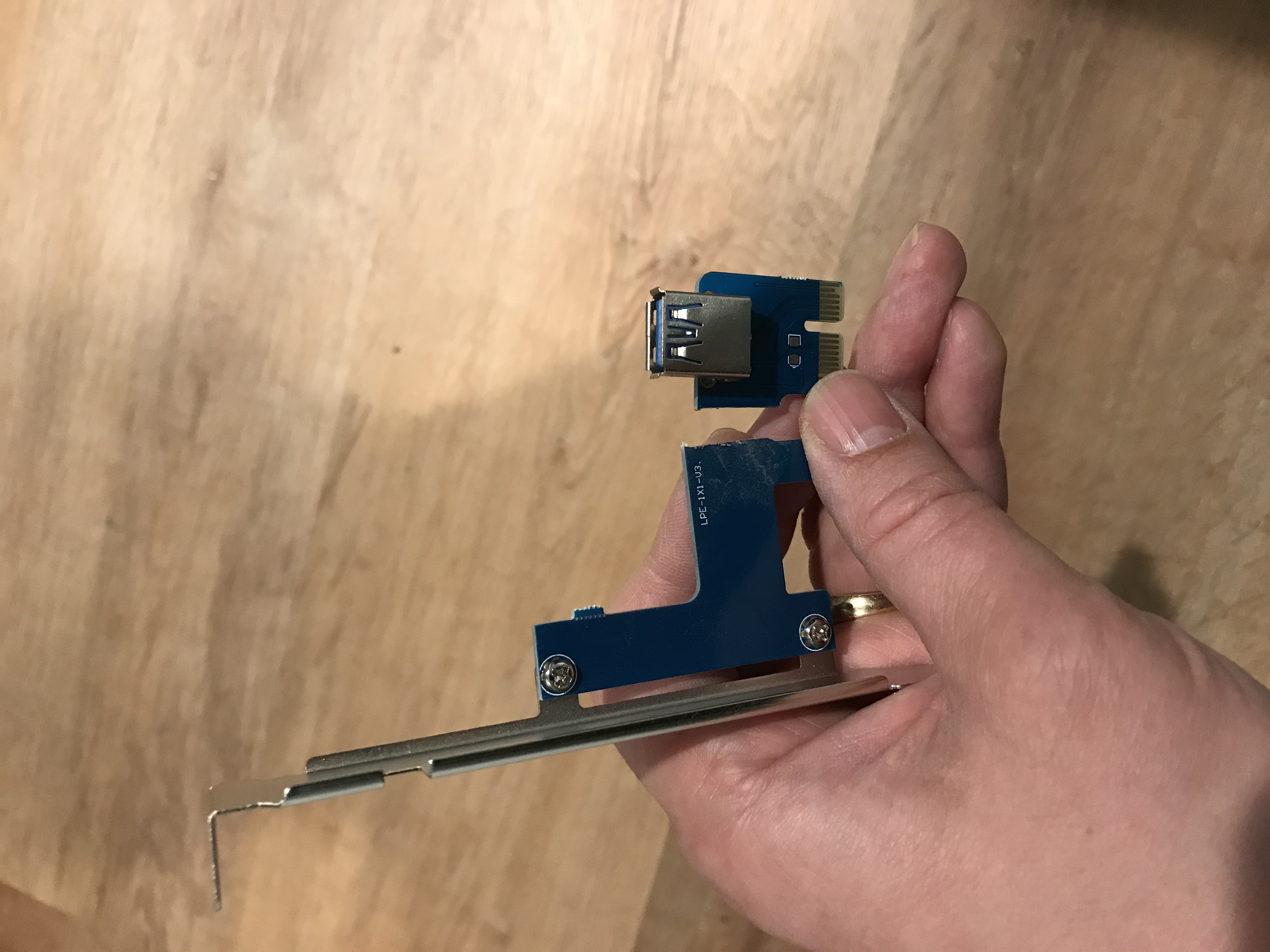 PCIe 1x card with a USB "port" cut off from the metal plate