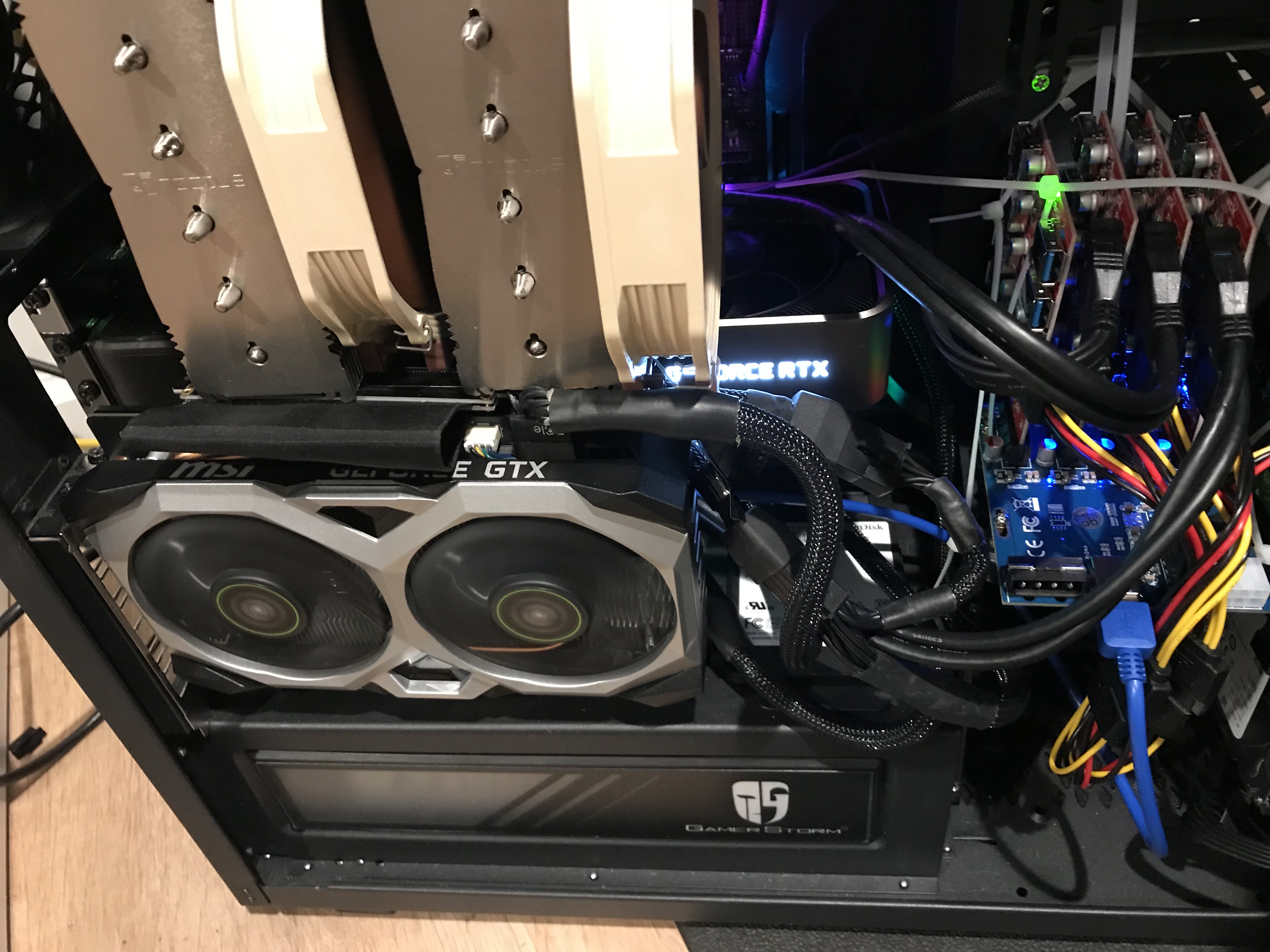 The PCIe switch with all four USB cards zip-tied into the last bit of empty space in my computer